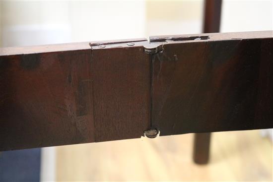 A Georgian mahogany card table with concertina action W.91cm